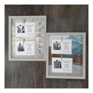 Grey frames with 2 pegs for photos and tree and mountain landscape backgrounds
