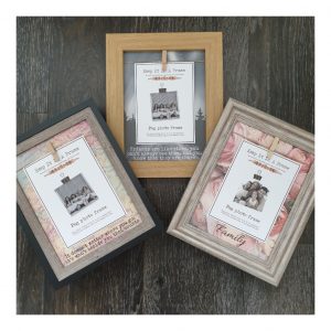 Three different peg photo frames with heart-warming quotes and family wording