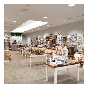 Inside a large gift shop called Canterbury Makes with table and wall displays