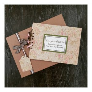 green and pink floral scrapbook with gift box and personalised grandchildren text